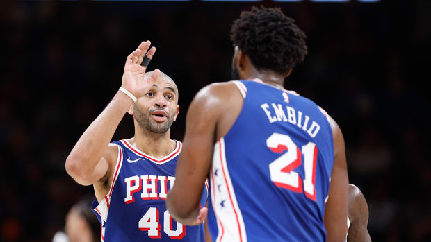 Philadelphia 76ers forward Nicolas Batum (40) talks to center Joel Embiid (21) during the second half against the Oklahoma City Thunder at Paycom Center.